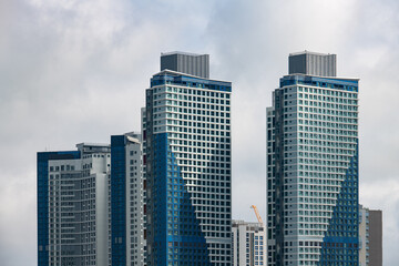 skyscrapers against cloudy sky