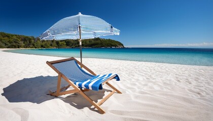 blue striped beach chair umbrella and towel on white sand beach umbrella beach towel