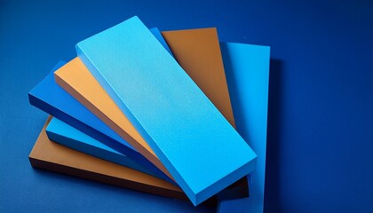 blocks of paper of different colors highlighting strong blue colors on a table