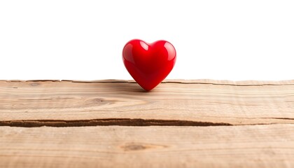 Red heart on a wooden surface against a white background.