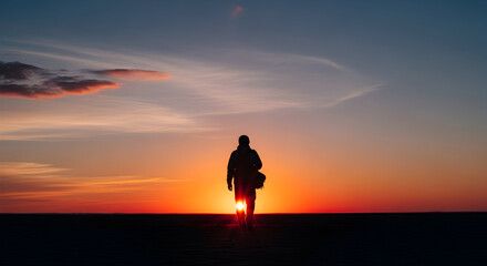 Fototapeta premium Silhouette of person at sunset