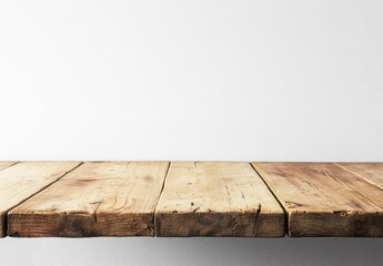 Minimal empty wooden table with natural wood grain against a clean white wall background, ideal for product display mockups, advertising templates, and digital marketing use