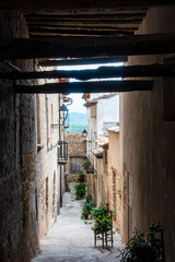 A narrow medieval alley (13th-18th century) in the historic old town of La Fresneda, Aragon, Spain.