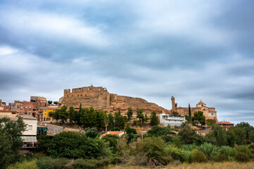 Obraz premium Ancient Medieval Skyline Maella Zaragoza Spain 14th Century Castle Fortress Ruins and Historic Gothic Church Townscape