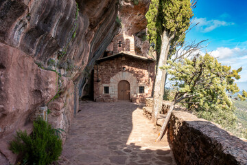 The 16th-century rock-hewn Hermitage of l'Abellera, a chapel built inside a cave in the Prades Mountains, Spain