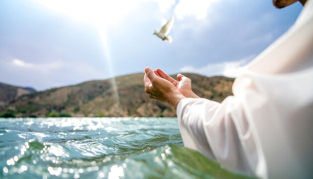 Person in white robe baptizing in water, dove in the sky
