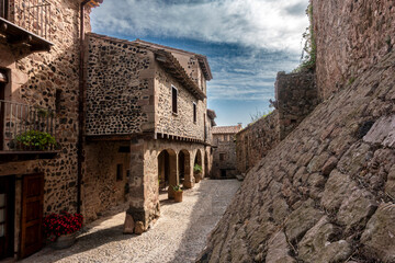 Ancient Stone Architecture Santa Pau Village Gerona Spain 13th Century Medieval Cobblestone Alley and Covered Archway