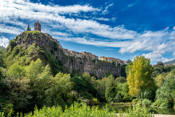 Historic Castellfollit de la Roca Village Gerona Spain Medieval Bell Tower on Basalt Cliff and Fluvial Landscape