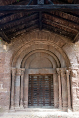 Historic Romanesque Architecture Sant Joan les Fonts Monastery Gerona Spain 12th Century Medieval Portal and Wooden Roof