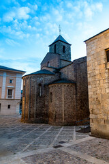 The ancient Romanesque apse of the Church of Sant Miquel in the cathedral complex of La Seu d'Urgell, pictured at twilight in the Catalan Pyrenees