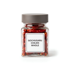 A glass jar of gochugaru chillies whole on white background