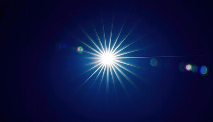 Obraz premium bright starburst light flare against deep blue night sky with radiant beams and lens glow creating cosmic abstract ethereal background ideal for expansive editorial banner or digital wallpaper