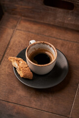 Cup of coffee on rustic wooden background. Soft focus. Copy space	