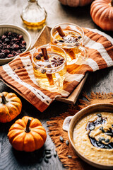 Apple cider with cinnamon , dried cranberries  and pumpkin soup