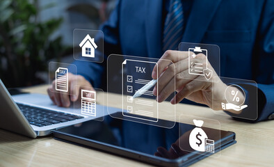 Businessman filing corporate and individual income tax return on tablet, concept of tax payment,...