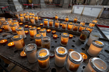 Votive candles burning inside the church of San Giorgio Maggiore, Venice, Italy