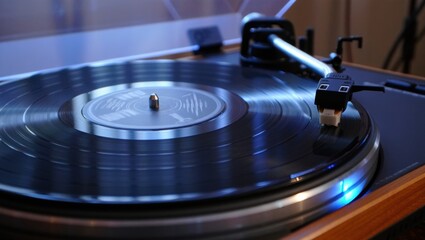 Turntable spins a vinyl record with a close-up needle and grooves