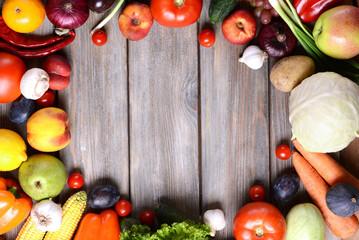 Fresh Organic Fruits and Vegetables on Rustic Wooden Background