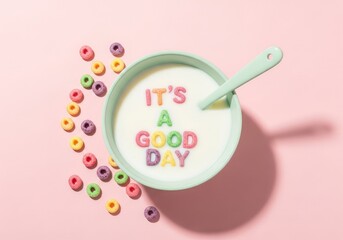Breakfast cereal with milk in a bowl pastel colors with the phrase its a good day made of colorful cereal pieces and a spoon all on a light pink background