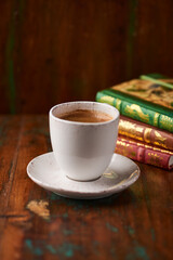 Cup of coffee on rustic wooden background. Soft focus. Copy space	