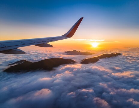 breathtaking aerial view of sunrise over cloud covered landscape with misty mountain peaks airplane wing silhouette adds travel exploration and serenity to this majestic natural scene - Powered by Adobe