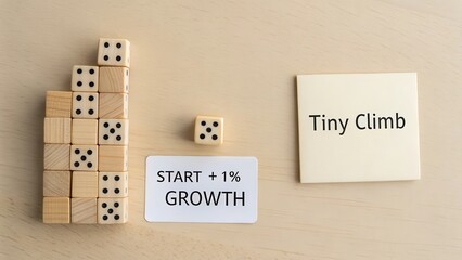 Domino tower representing business start and growth on wooden board
