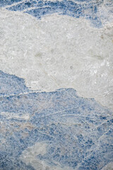 Blue and White marbled crystal texture abstract background; Icy blue and white crystals of a geology specimen cross section