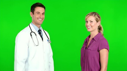 Happy doctor and patient standing side by side with a green screen background, smiling, ready for a health related subject or project