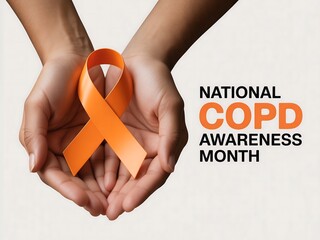 Hands holding an orange ribbon symbolizing national copd awareness month and support for lung health