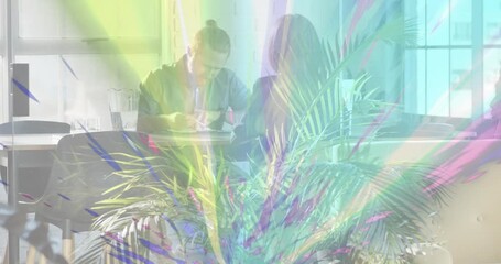 Colleagues planning business at table in coworking hub with glitch bursting across frame and fading - Powered by Adobe