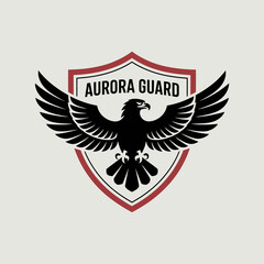 Obraz premium Aurora Guard Eagle Shield Logo, Eagle, Shield, Guard, Security, Protection, Defense, Vigilance, Patriotism, Freedom, Strength, Wings, Emblem, Badge, Heraldry, Valor, Honor, Sentinel, Fortress, Safety,