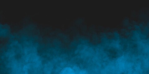 Abstract blue smoke moves on black background.Beautiful swirling blue smoke. Wide angle horizontal wallpaper or web banner.