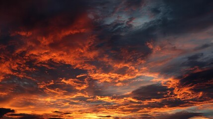 Dramatic Sunset Over a Cloudy Sky with Vibrant Orange and Red Hues