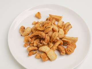 Crunchy banana chips on white background