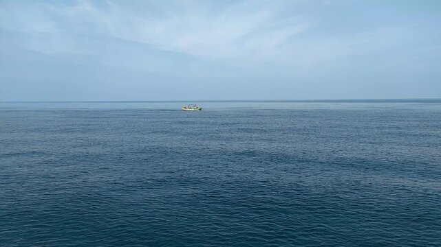 Indonesia - 25 September 2025 A traditional wooden fishing boat is sailing to catch fish in the Java Sea, Indonesia.