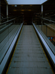 Escalator up to a dark floor