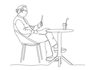 Man in glasses using mobile or tablet at street cafe table with drink. Continuous line drawing. Black and white vector illustration in line art style.