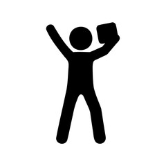 Silhouette of a happy person holding a book with one arm raised
