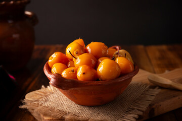 Tejocote en almibar. Typical Mexican dessert made with Tejocote (Crataegus mexicana), a Mexican fruit in syrup, a fruit widely used in autumn, the Day of the Dead, posadas and the Christmas season.