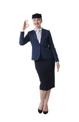 Charming stewardess showing okay gesture on white background