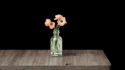 Peach flowers in a bottle on wooden table