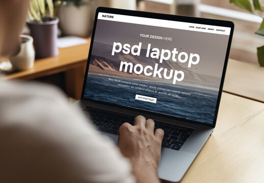 Mockup of a man behind a laptop
