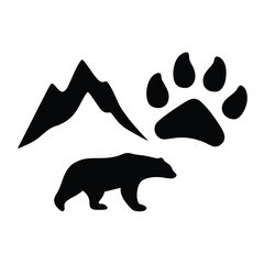 Silhouette of a bear mountain range and a large paw print in black and white