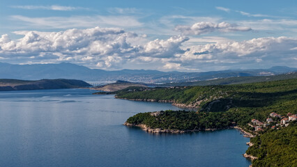 Aerial drone view of Crikvenica and Dramalj with turquoise Adriatic Sea, green-blue waters, beaches, and the island of Krk in the distance. Taken on 27.09.2025 in Dramalj, Croatia.