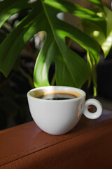 A cup of black coffee in a cafe with copy space