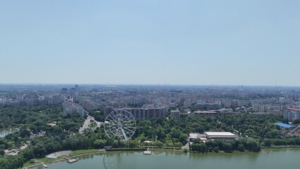 Aerial drone shot with panoramic view of Bucharest city skyline on the horizon, Romania
