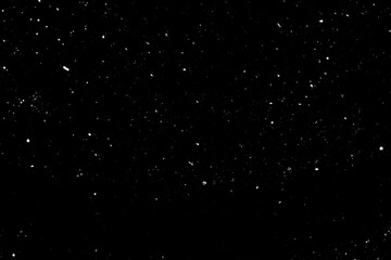 Falling Snow down On The Black Background. Blurry flecks snow overlay. White spots on black background. Abstract speckles overlay. Snowfall on black background - design element. For photo edit