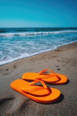 Bright Orange Flip-Flops on Sandy Beach
