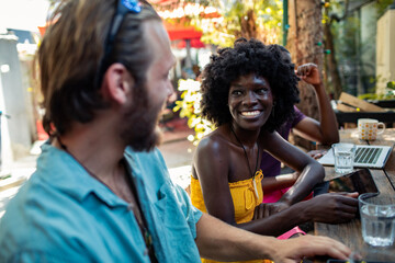 Friends enjoying conversation in a cafe