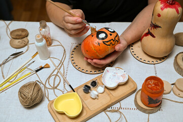 
Preparing to paint a pumpkin for Halloween at home